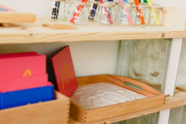 Montessori Sandpaper Letters on the Shelf in the Classroom